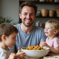 Smiling client E, a family man, enjoying a healthy meal with his children